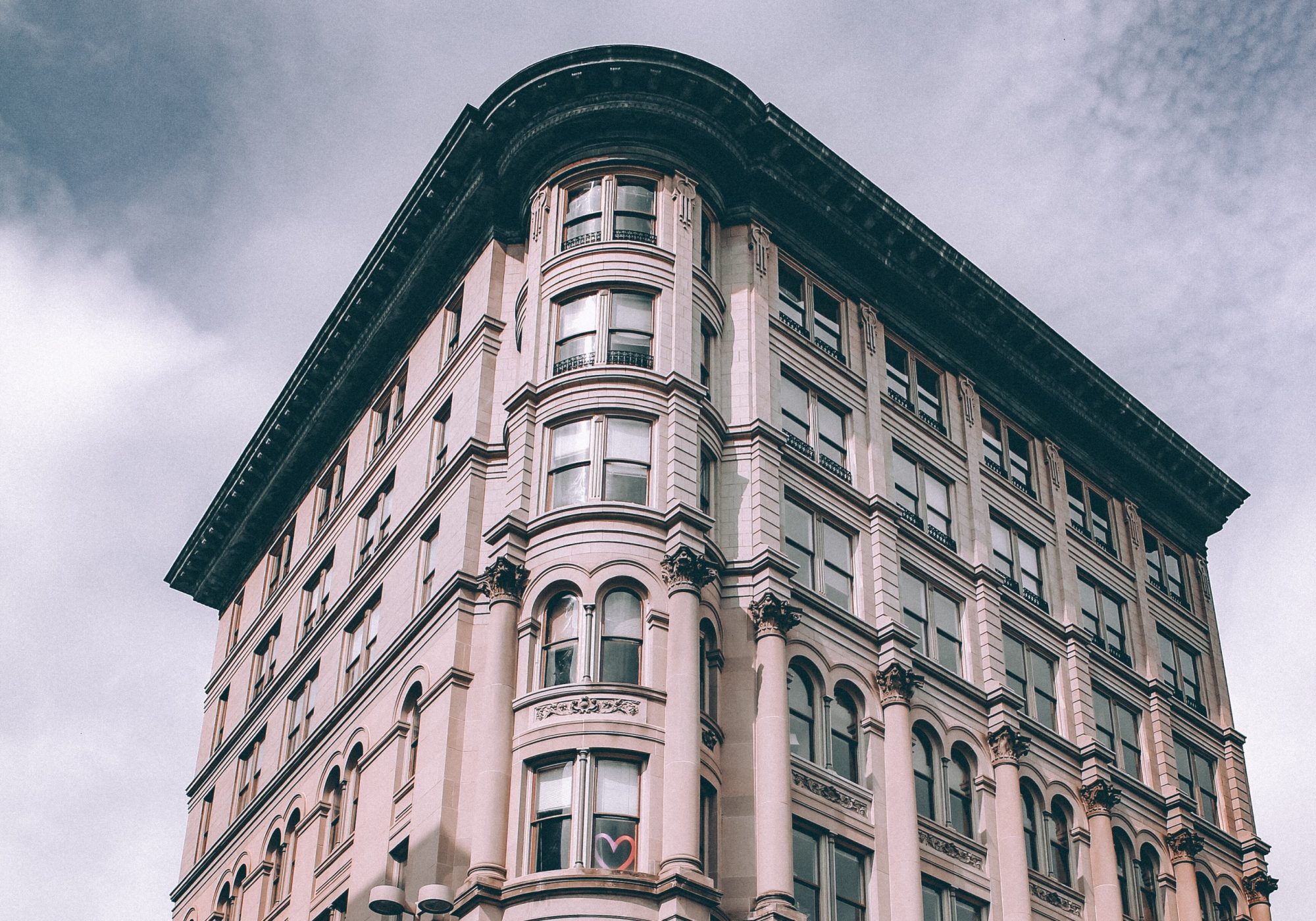 Ornate historic corner office building against the sky
